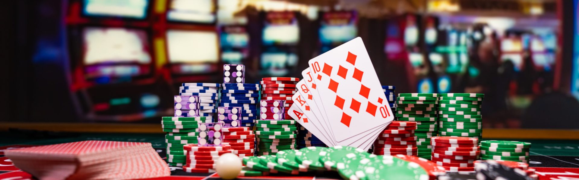 Casino set with Roulette, cards, dice and chips on BlackJack mat